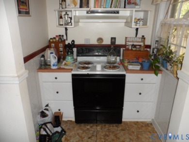 Welcome home to this brick cape cod with a slate roof in the