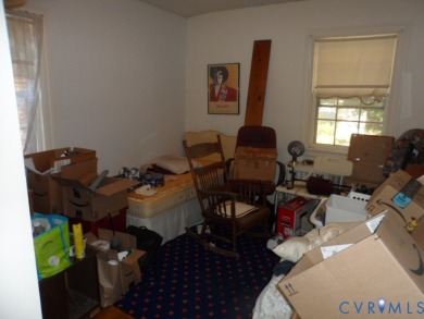 Welcome home to this brick cape cod with a slate roof in the