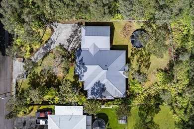 Set behind a concrete masonry front wall with a gated driveway - photo 3