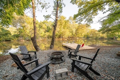 Nestled on a beautiful creek bank with water access to the - photo 2