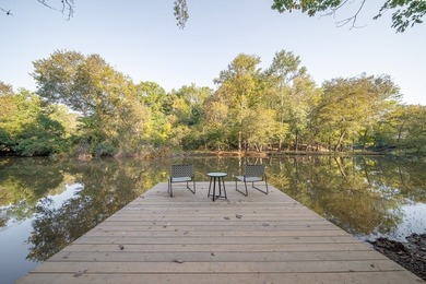 Nestled on a beautiful creek bank with water access to the - photo 3