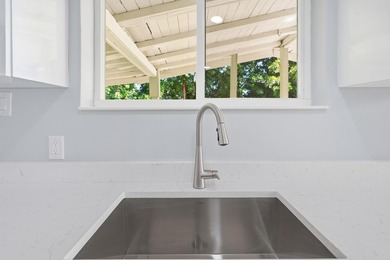 This charming single family home is tucked away in the back - photo 14