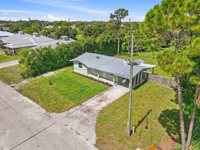 This charming single family home is tucked away in the back - photo 31