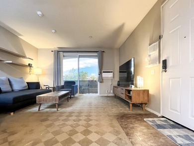 Discover this charming top-floor condo nestled in the - photo 1