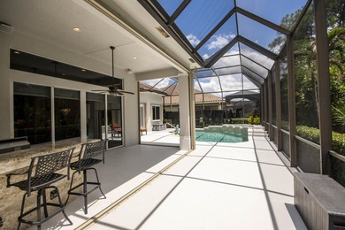 A private backyard oasis with a screened pool, outdoor kitchen - photo 5