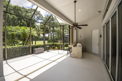 A private backyard oasis with a screened pool, outdoor kitchen - photo 6