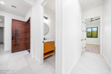 A shining new home in the Catalina Foothills. Located within