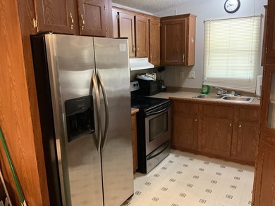 The owner has taken great care of the home and looks great. The - photo 6