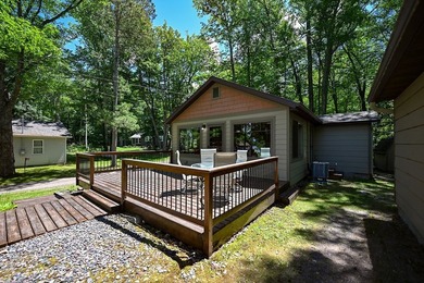 Escape to this charming four-season cabin on highly sought-after - photo 21