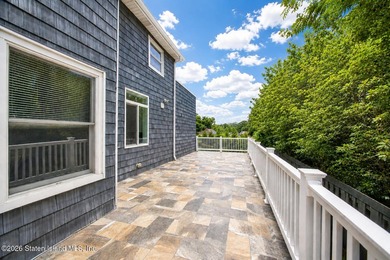 Welcome to 5434 Amboy Road - an exceptional legal two-family - photo 11