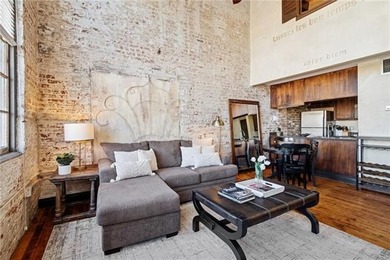 This charming, custom-designed two-bedroom condo at the historic