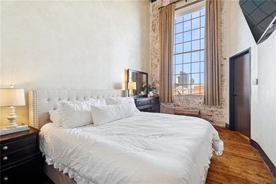 This charming, custom-designed two-bedroom condo at the historic