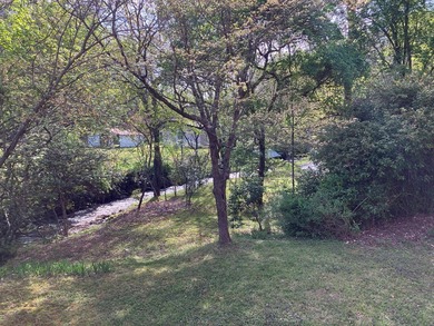 Welcome to your Creekfront Oasis, located in the sought-after