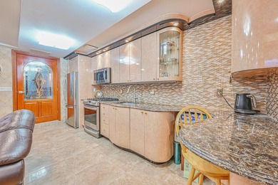 Welcome to this beautifully renovated legal two-family brick - photo 16