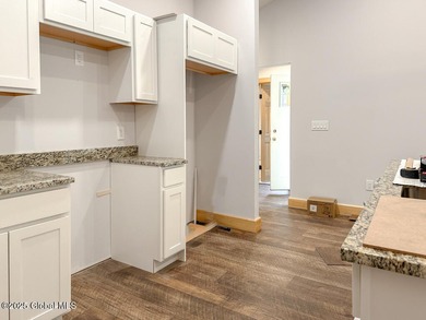 Modern raised ranch nearing completion with Lake George lake - photo 3
