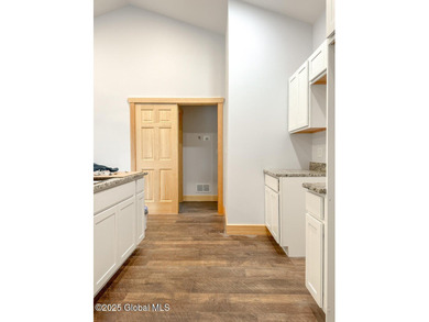 Modern raised ranch nearing completion with Lake George lake - photo 4