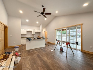 Modern raised ranch nearing completion with Lake George lake - photo 5