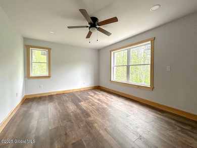Modern raised ranch nearing completion with Lake George lake - photo 8