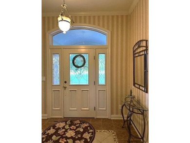This gorgeous three-to-four-bedroom home is setting on a - photo 3
