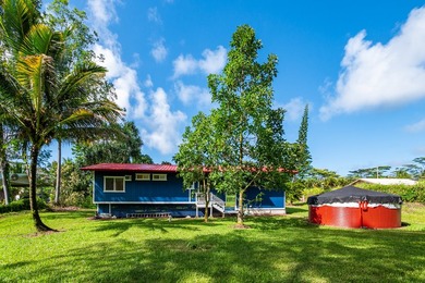 Tucked away on a lush 1-acre lot in Hawaiian Paradise Park, this - photo 4
