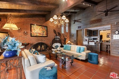 Welcome to this magnificent Spanish-style estate in the - photo 1