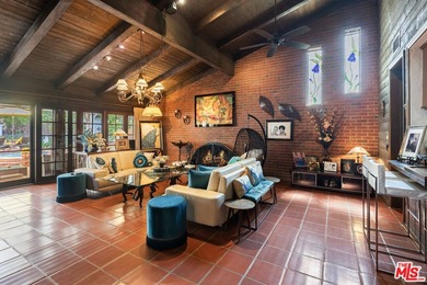 Welcome to this magnificent Spanish-style estate in the - photo 2