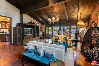 Welcome to this magnificent Spanish-style estate in the - photo 3