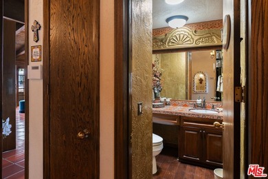 Welcome to this magnificent Spanish-style estate in the - photo 7