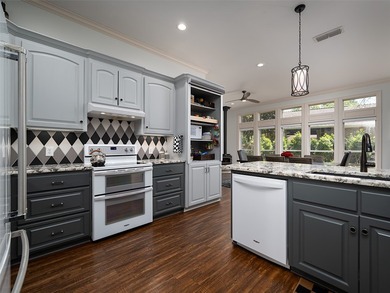 Discover the comfort of this exquisite four bedroom, three bath - photo 12