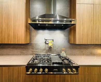 Welcome to a masterpiece of modern elegance set on a coveted - photo 4