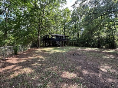 Private East Texas retreat nestled among the trees on 1.24 - photo 11