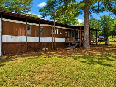 Just minutes from the shores of Lake Eufaula, this charming lake - photo 1