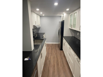This spacious 2-bedroom, 2-bathroom unit features an open living - photo 1