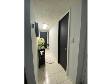 This spacious 2-bedroom, 2-bathroom unit features an open living - photo 2