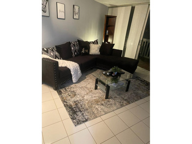 This spacious 2-bedroom, 2-bathroom unit features an open living - photo 4