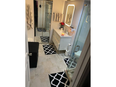 This spacious 2-bedroom, 2-bathroom unit features an open living - photo 7