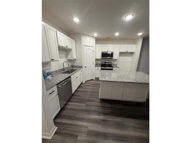 MUST SEE this modern, well maintained, 2021 built townhome with - photo 3