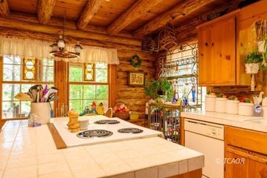 Welcome to your dream home-a stunning log cabin blending classic - photo 17