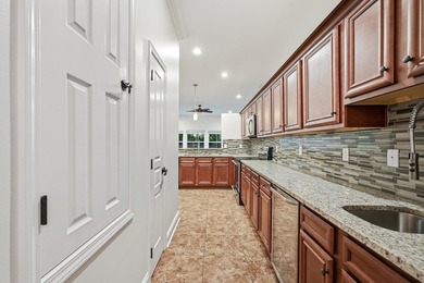 Beautifully maintained 4-bedroom, 3-bath brick home tucked away - photo 13