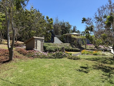 Perched atop a private hilltop with Pacific Ocean views, this - photo 6