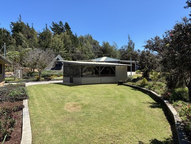 Perched atop a private hilltop with Pacific Ocean views, this - photo 10