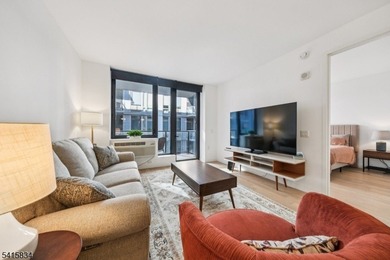 Discover sophisticated city living in this bright and spacious - photo 1