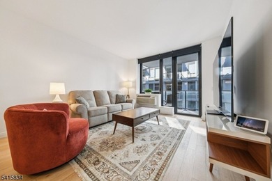 Discover sophisticated city living in this bright and spacious - photo 2