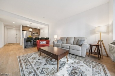 Discover sophisticated city living in this bright and spacious - photo 3