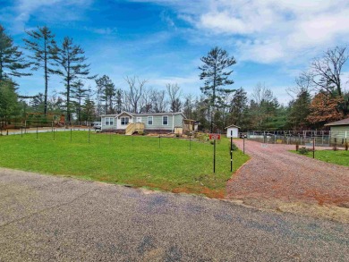 Paradise awaits. This home is just blocks from Castle Rock Lake - Lake Home For Sale in Friendship, Wisconsin