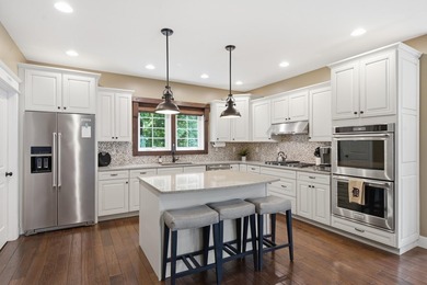 Welcome to this exceptional two-story walkout nestled on a - photo 9