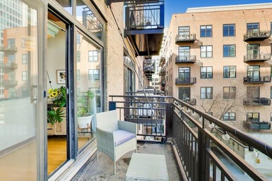 Step into this stunning brick-and-timber loft at the Premiere