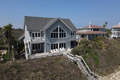 Poised atop a picturesque dune, this remarkable home offers - photo 1