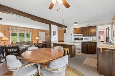 Discover the perfect lake retreat with this charming cabin on - photo 13