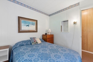 Discover the perfect lake retreat with this charming cabin on - photo 19